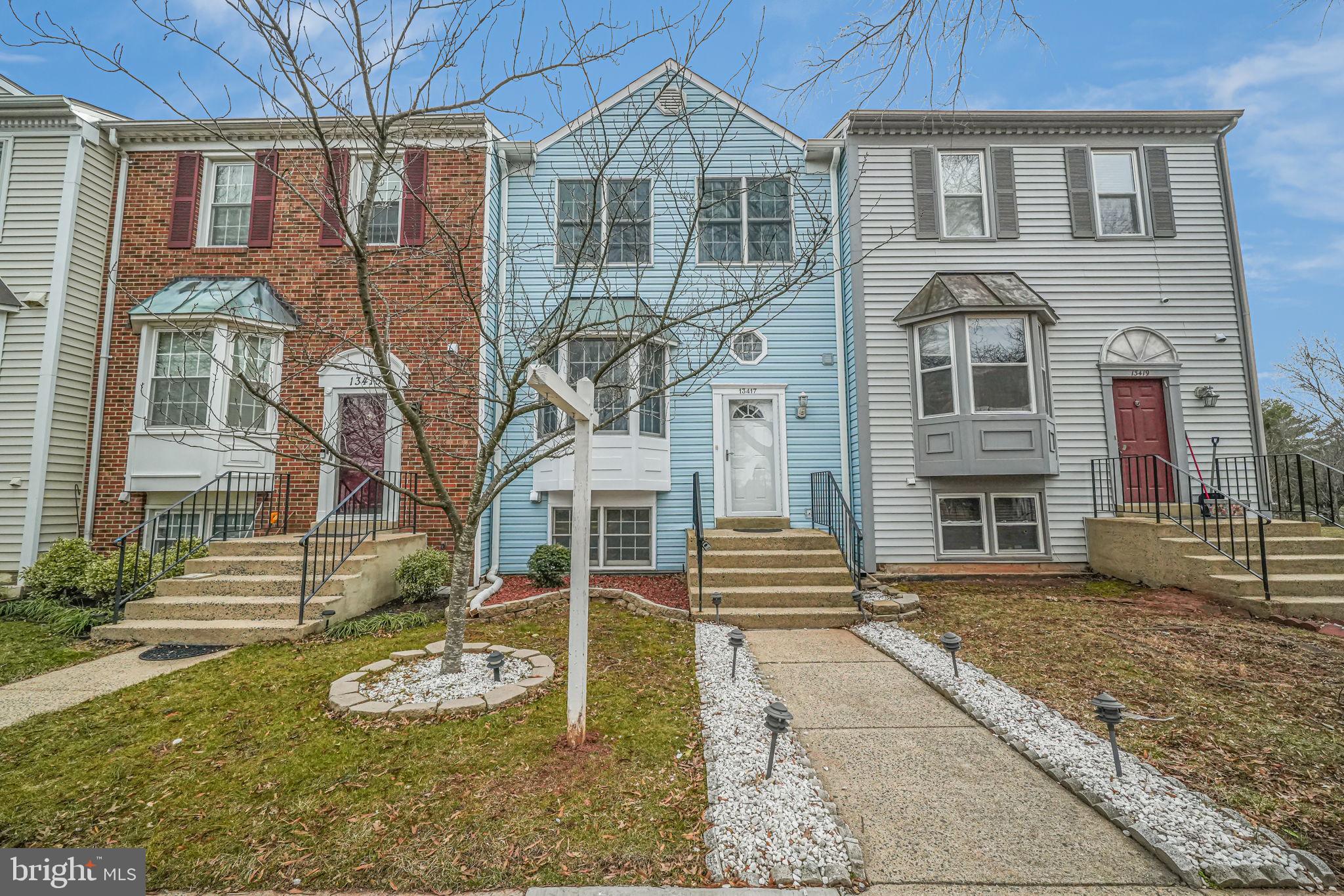 13417 Elevation Lane Herndon, VA 20171 - Photo 25 of 30 a front view of a house with a yard