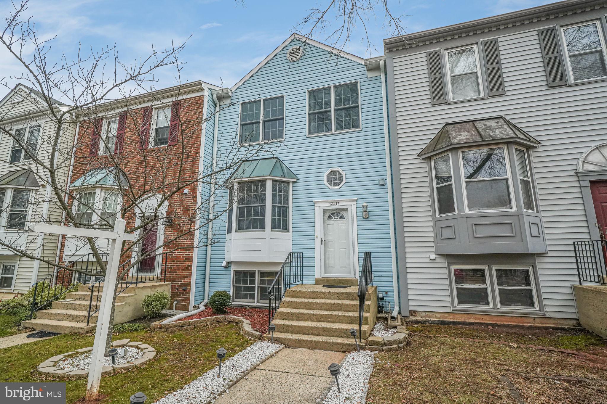 13417 Elevation Lane Herndon, VA 20171 - Photo 26 of 30 a front view of a house with a yard