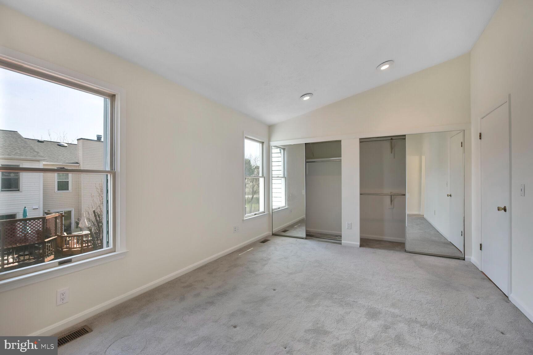 13417 Elevation Lane Herndon, VA 20171 - Photo 6 of 30 a view of an empty room with a window