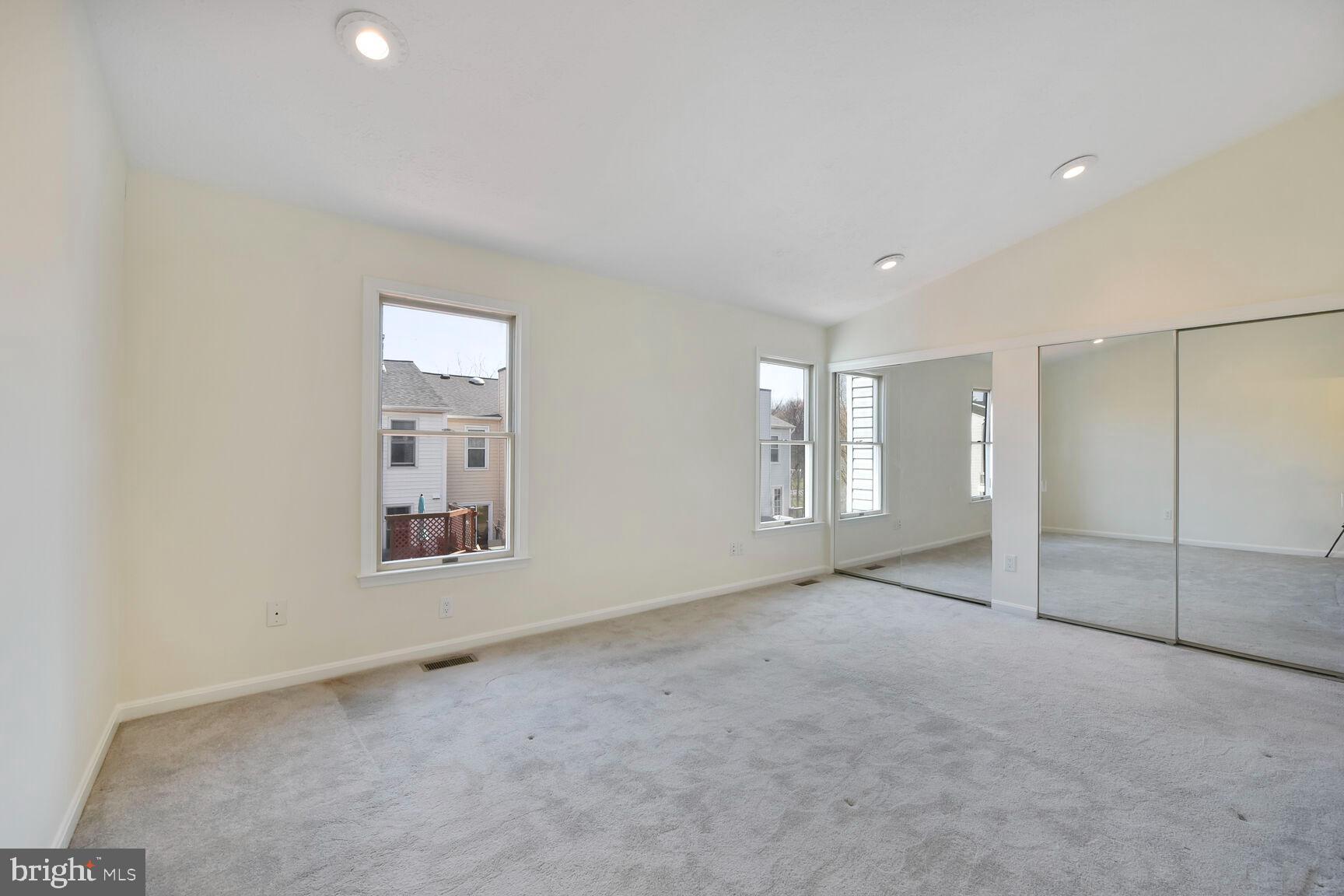 13417 Elevation Lane Herndon, VA 20171 - Photo 7 of 30 an empty room with windows and closet