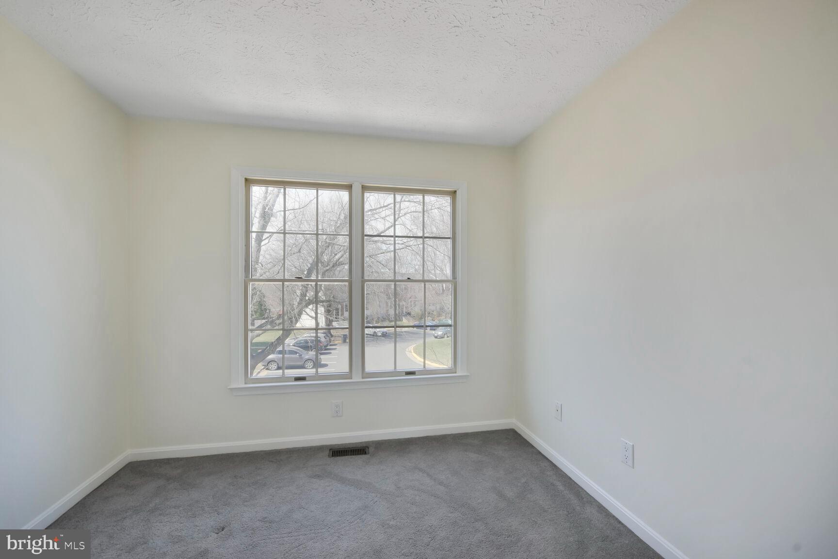 13417 Elevation Lane Herndon, VA 20171 - Photo 8 of 30 an empty room with a window