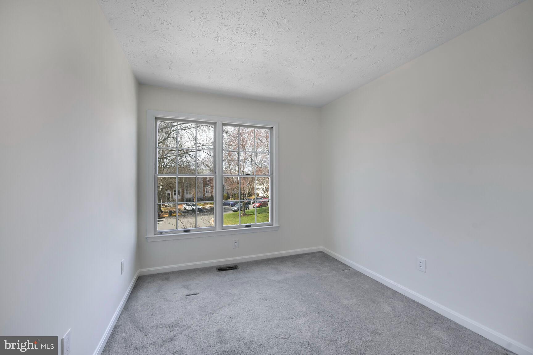 13417 Elevation Lane Herndon, VA 20171 - Photo 9 of 30 an empty room with a window