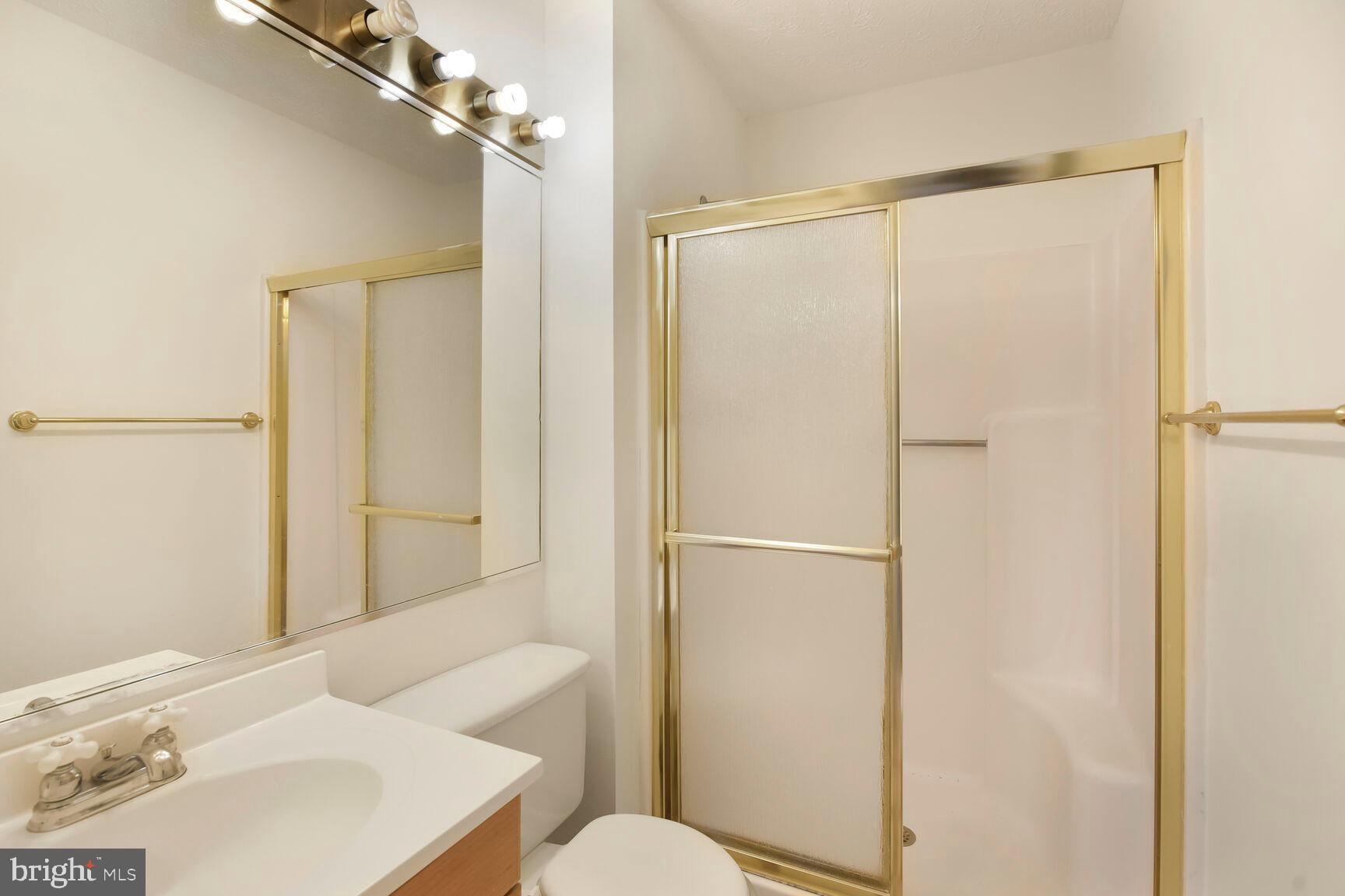 13417 Elevation Lane Herndon, VA 20171 - Photo 10 of 30 a bathroom with a sink toilet and shower