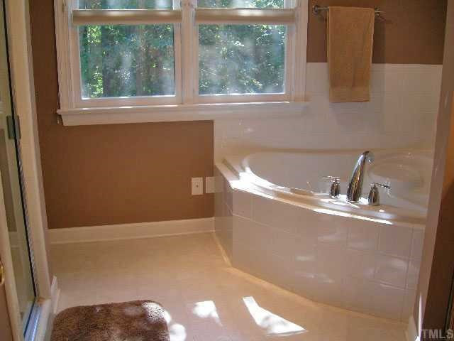 8800 Bickley Place Raleigh, NC 27613 - Photo 11 of 12 New Corner Air Tub (03), new faucet and door hardware. Seperate SHower with tile surround. Master Bath/Spa