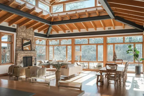 a living room with fireplace furniture and a fireplace