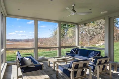 a view of entryway with wooden floor and stairs