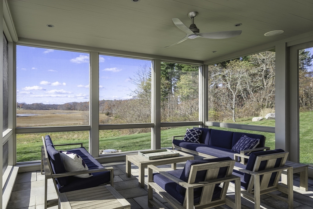 154 Argilla Road Ipswich, MA 01938 - Photo 17 of 42 a living room with furniture and floor to ceiling windows