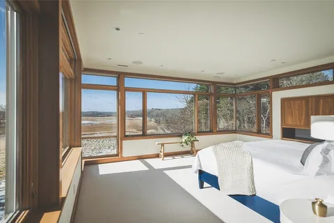a bathroom with a tub sink shower and mirror