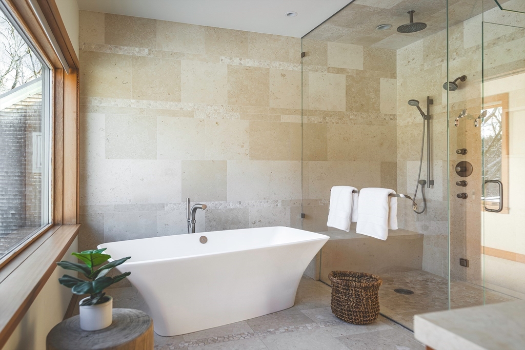 154 Argilla Road Ipswich, MA 01938 - Photo 24 of 42 a white bath tub sitting in a bathroom next to a window