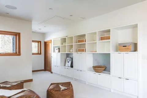 a bathroom with a granite countertop sink mirror and double