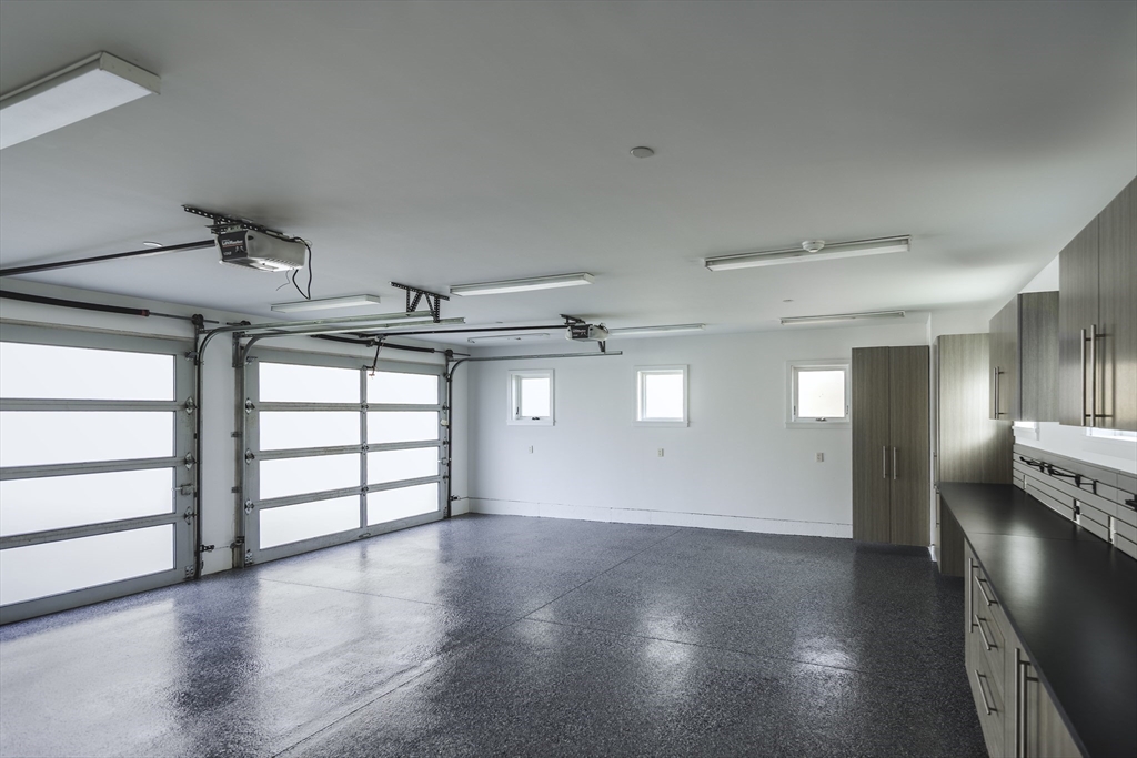 154 Argilla Road Ipswich, MA 01938 - Photo 31 of 42 an empty room with windows and pillars in it