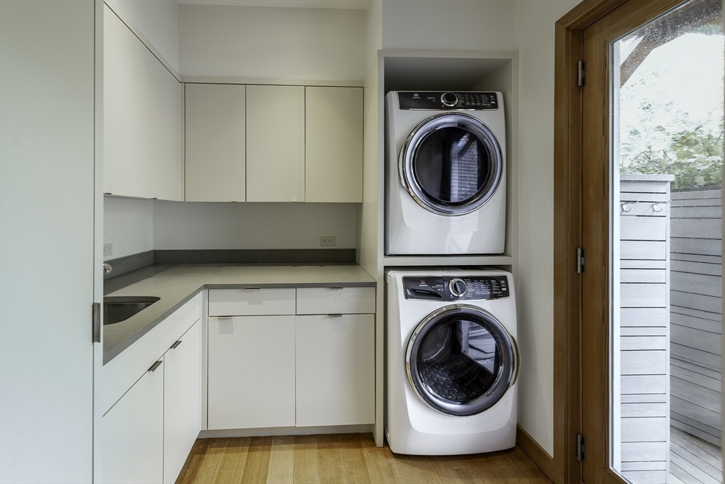 154 Argilla Road Ipswich, MA 01938 - Photo 32 of 42 a utility room with sink dryer and washer
