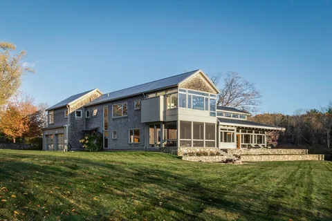 a front view of a house with a yard