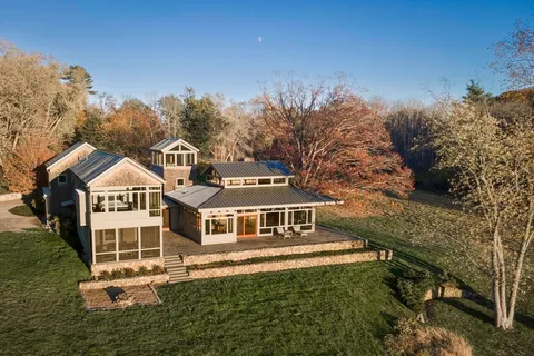 a front view of a house with yard