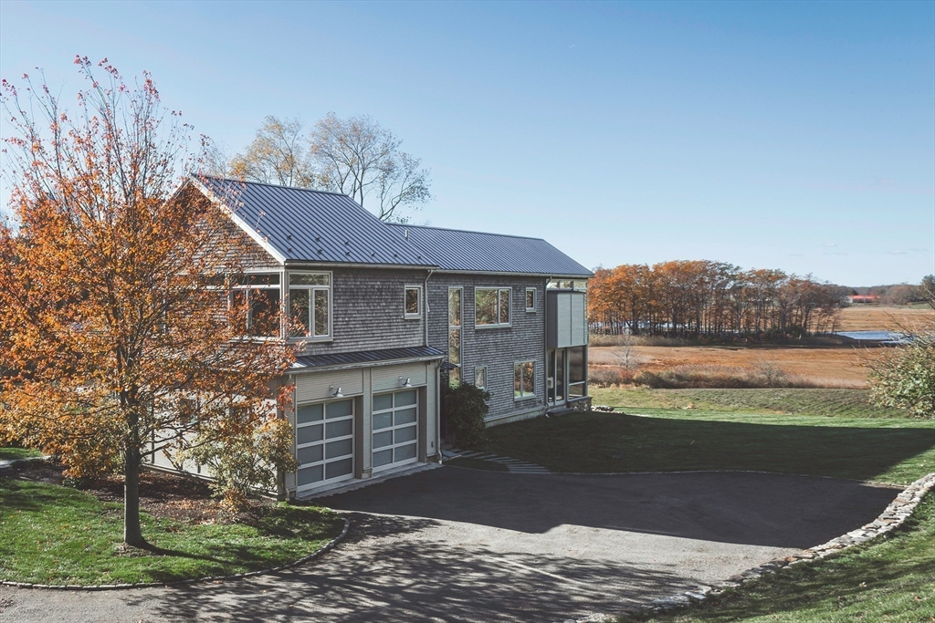 154 Argilla Road Ipswich, MA 01938 - Photo 40 of 42 a front view of a house with a yard