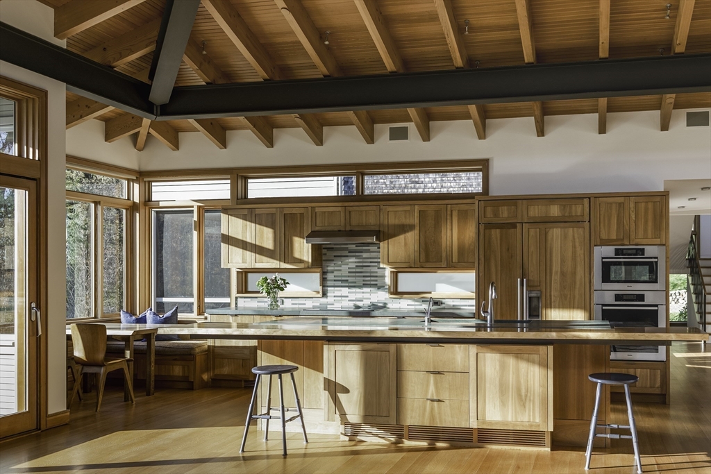 154 Argilla Road Ipswich, MA 01938 - Photo 9 of 42 a kitchen with granite countertop lots of counter top space and dining table