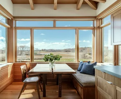 a dining room with furniture water view and a fireplace