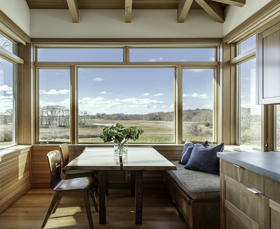 154 Argilla Road Ipswich, MA 01938 - Photo 10 of 42 a living room with furniture and a large window