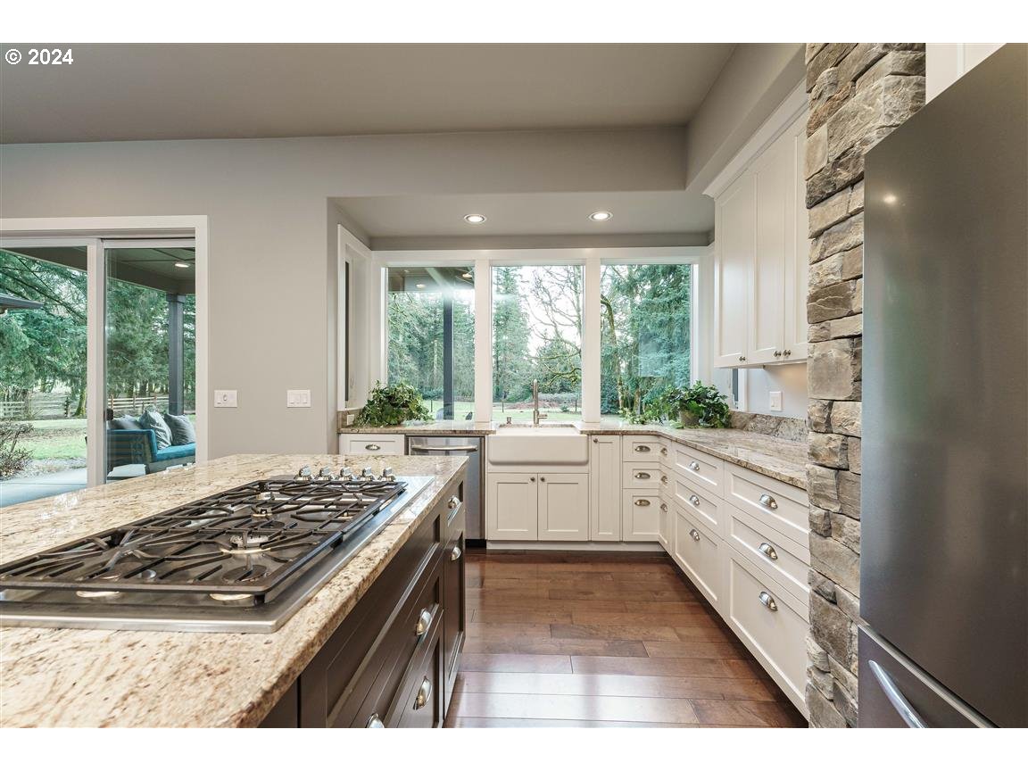27015 Northeast Hathaway Road Camas, WA 98607 - Photo 11 of 48 a kitchen with a stove a sink and a refrigerator