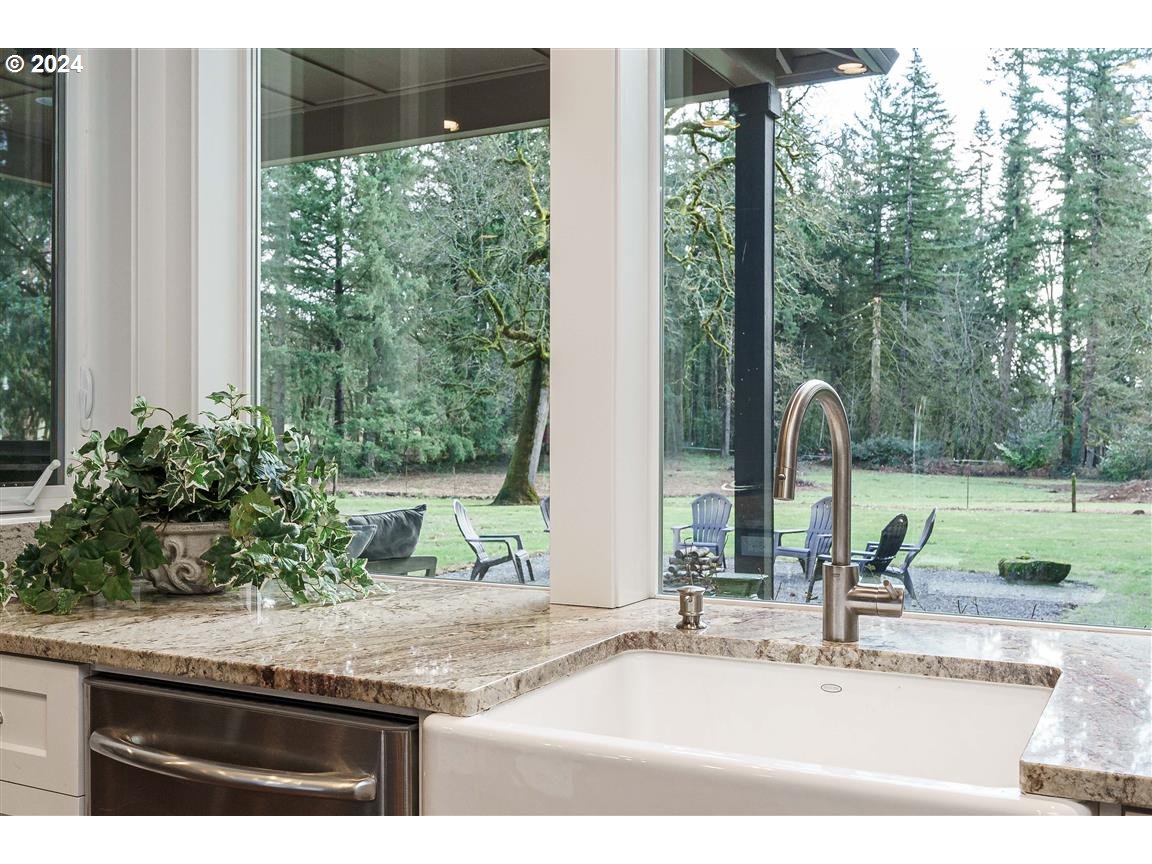 27015 Northeast Hathaway Road Camas, WA 98607 - Photo 13 of 48 a bathroom with a granite countertop sink and a large mirror