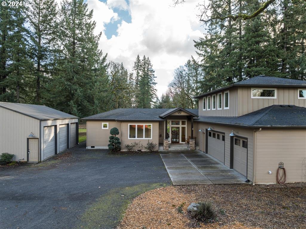 27015 Northeast Hathaway Road Camas, WA 98607 - Photo 2 of 48 a front view of a house with a yard and trees