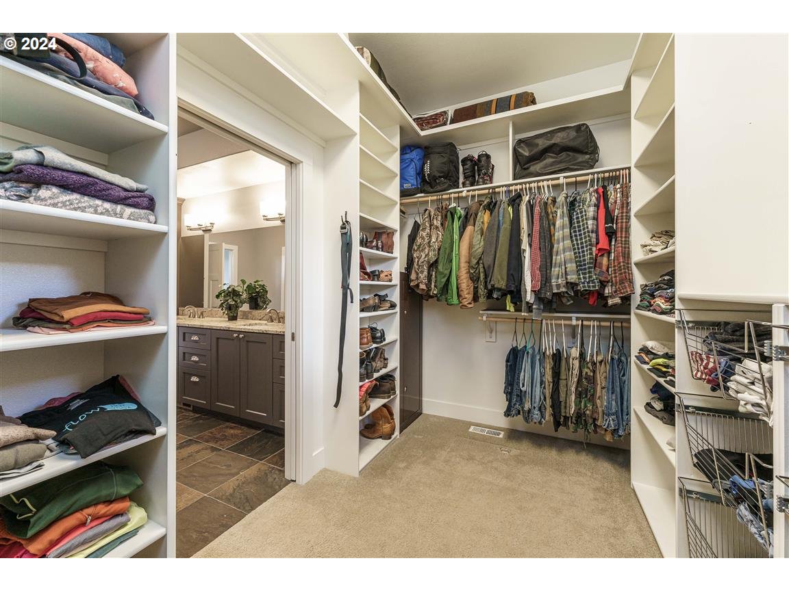27015 Northeast Hathaway Road Camas, WA 98607 - Photo 23 of 48 a view of walk in closet with clothes and shoes