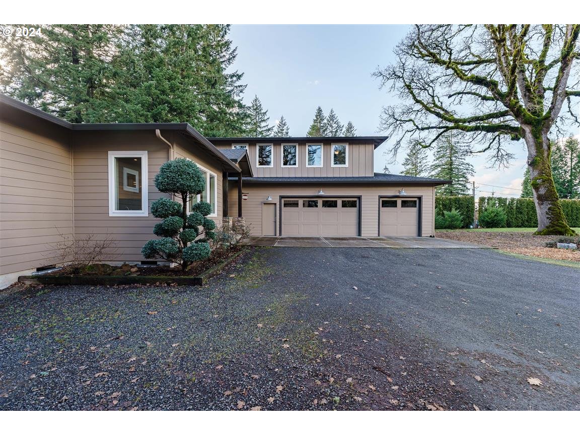 27015 Northeast Hathaway Road Camas, WA 98607 - Photo 3 of 48 a view of a house with a yard