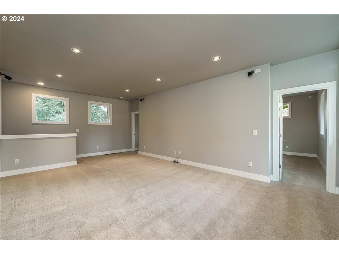 27015 Northeast Hathaway Road Camas, WA 98607 - Photo 35 of 48 a view of an empty room with window and wooden floor
