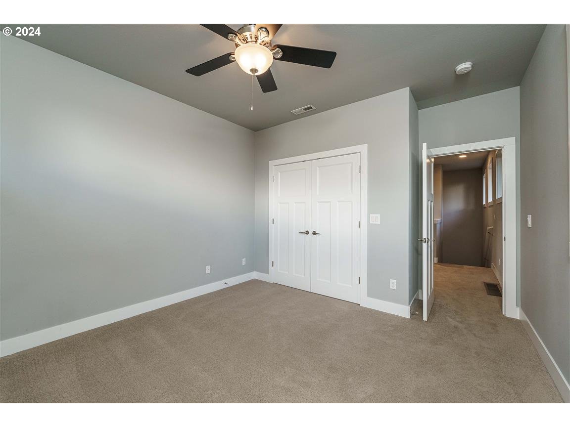 27015 Northeast Hathaway Road Camas, WA 98607 - Photo 39 of 48 en empty room with chandelier fan and windows