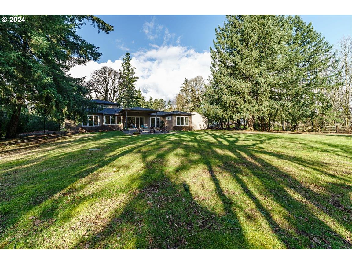 27015 Northeast Hathaway Road Camas, WA 98607 - Photo 40 of 48 a view of swimming pool with yard and trees in the background
