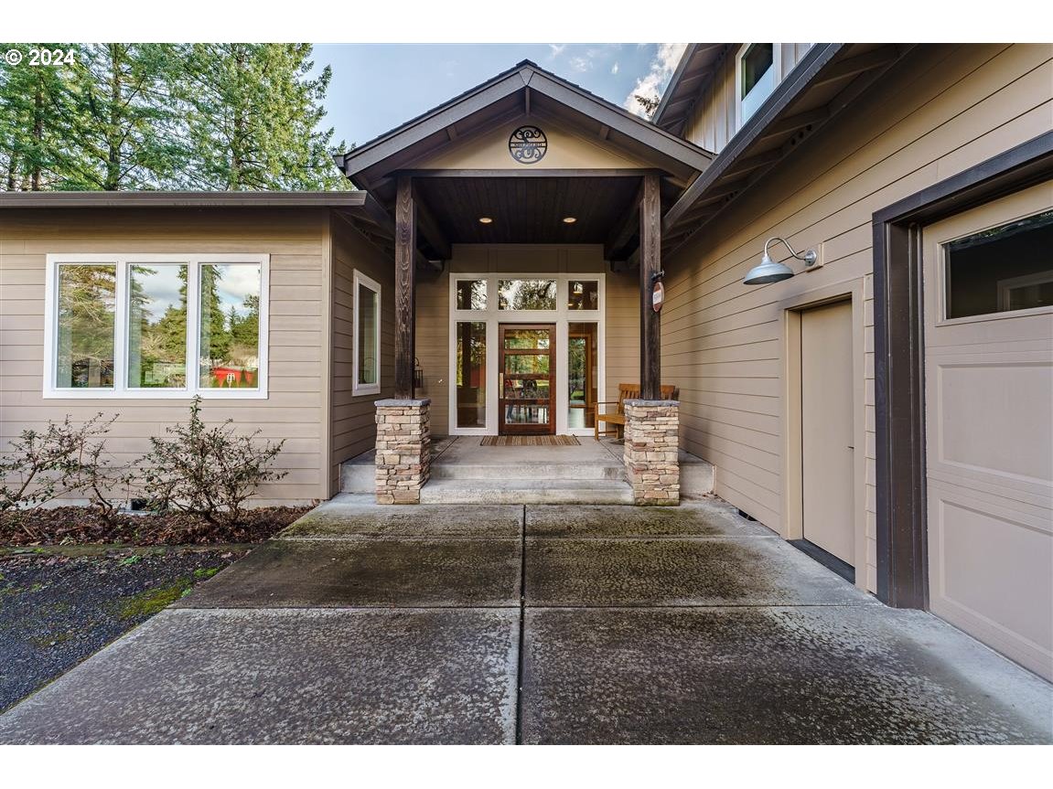 27015 Northeast Hathaway Road Camas, WA 98607 - Photo 4 of 48 a view of a house with many windows and yard