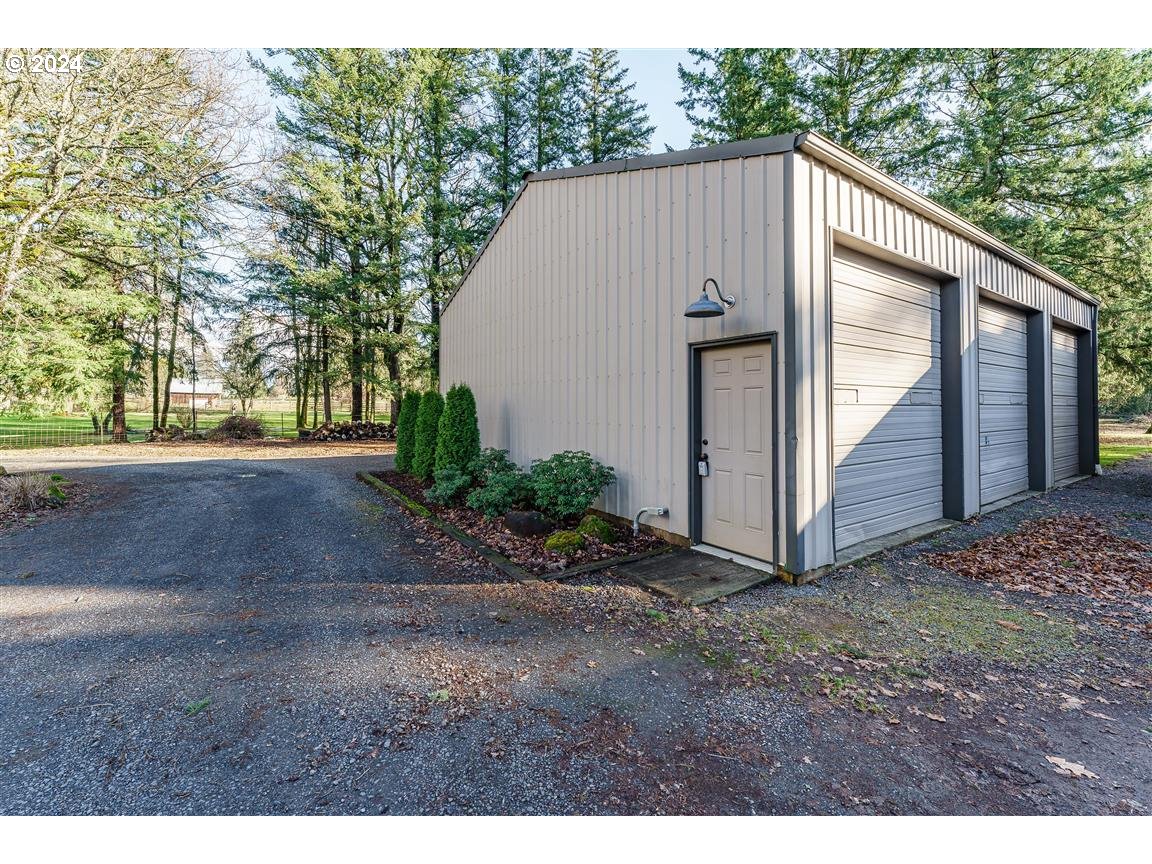 27015 Northeast Hathaway Road Camas, WA 98607 - Photo 45 of 48 a view of a house with backyard and trees