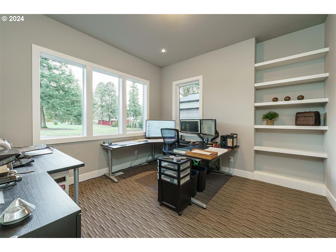 27015 Northeast Hathaway Road Camas, WA 98607 - Photo 6 of 48 a living room with furniture a wooden floor and a large window