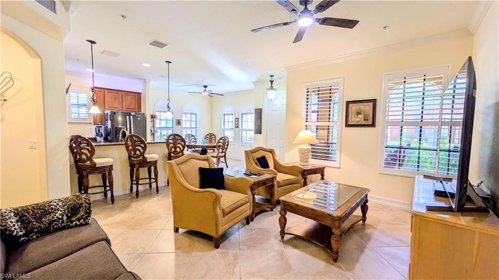 9081 Albion Lane South, Unit 6505 Naples, FL 34113 - Photo 13 of 41 a living room with furniture pool table and a window