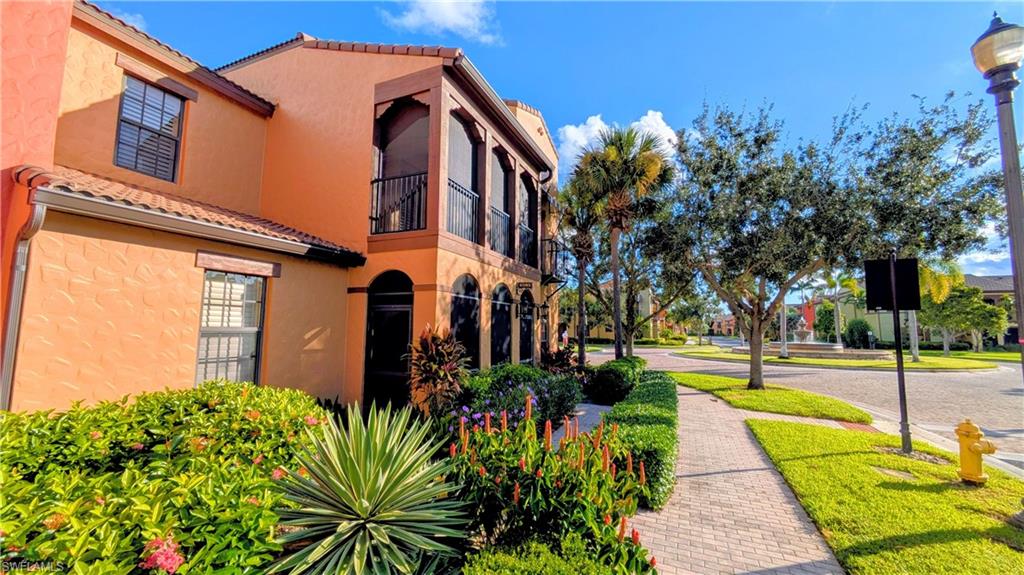 9081 Albion Lane South, Unit 6505 Naples, FL 34113 - Photo 4 of 41 a view of a house with a yard