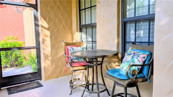 a view of an outdoor dining space with furniture