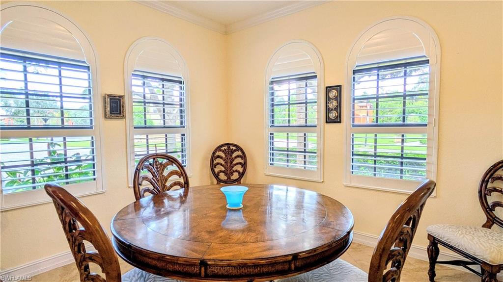 9081 Albion Lane South, Unit 6505 Naples, FL 34113 - Photo 8 of 41 a view of a dining room with furniture window and outside view