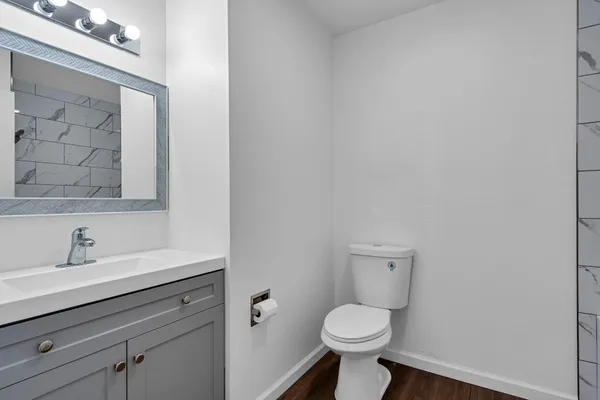 a bathroom with a toilet and a shower