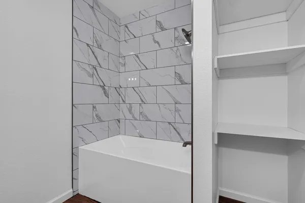 a bathroom with a sink toilet and a mirror