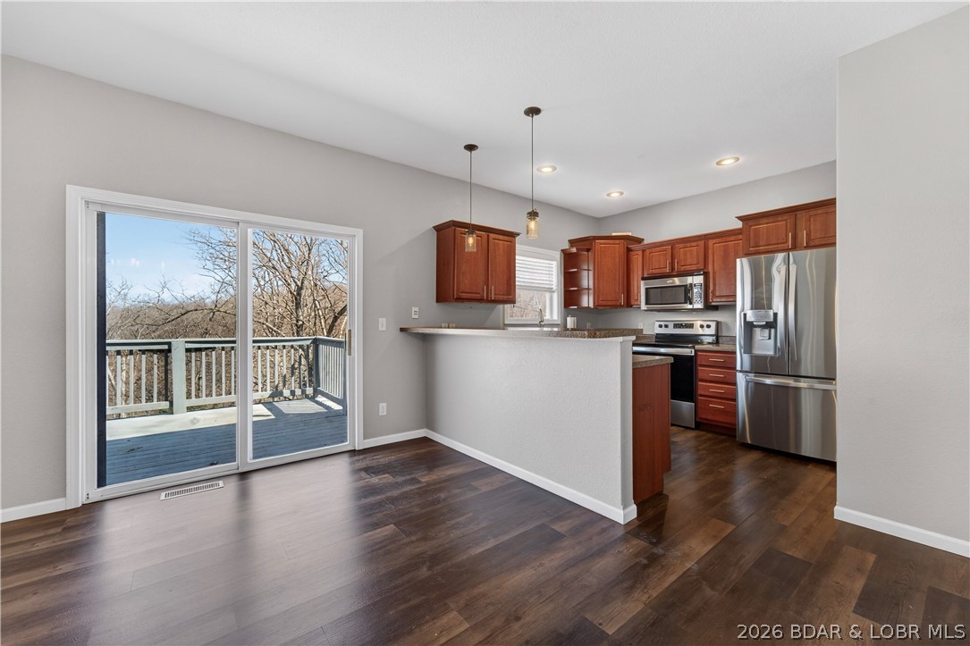 109 Reddington Road Four Seasons, MO 65049 - Photo 14 of 71 The living area opens directly onto an open deck,