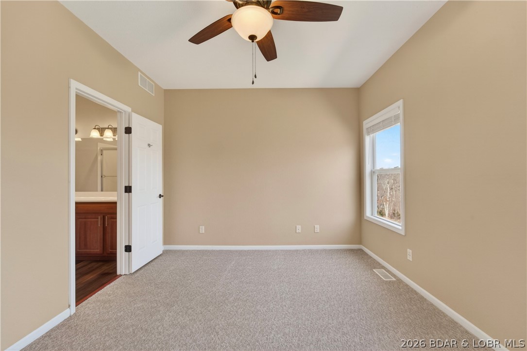 109 Reddington Road Four Seasons, MO 65049 - Photo 26 of 71 A private full bath located directly off the prima