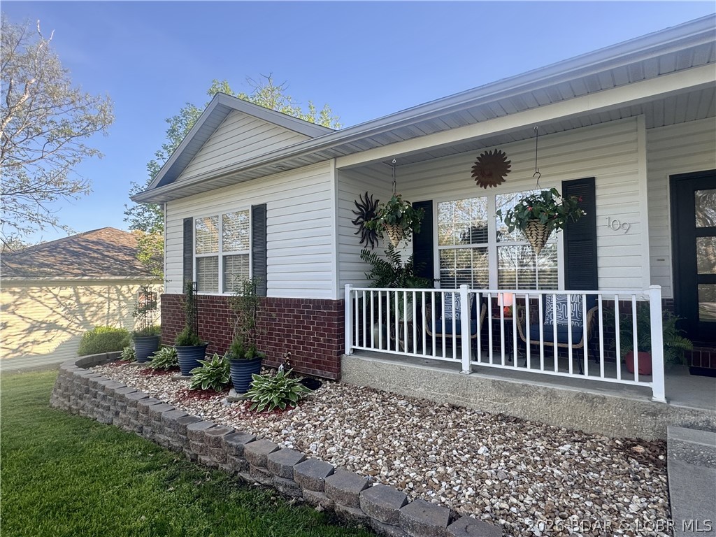 109 Reddington Road Four Seasons, MO 65049 - Photo 3 of 71 Relax on the charming front porch, featuring clean
