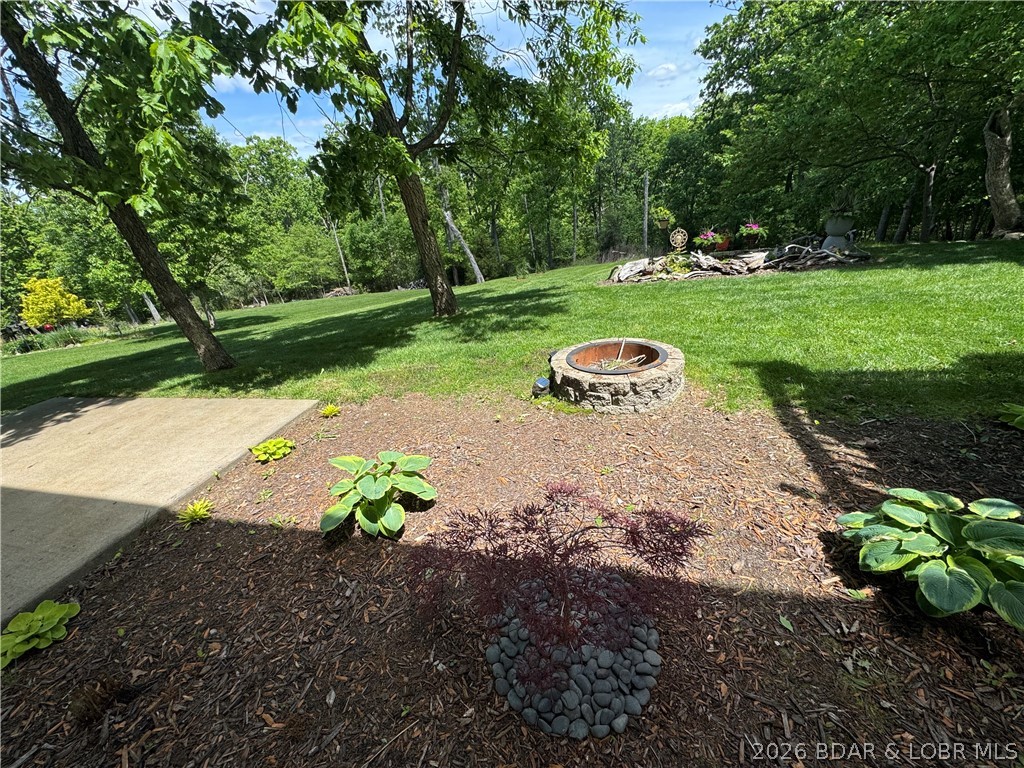 109 Reddington Road Four Seasons, MO 65049 - Photo 48 of 71 Gather around the stone fire pit for perfect Misso