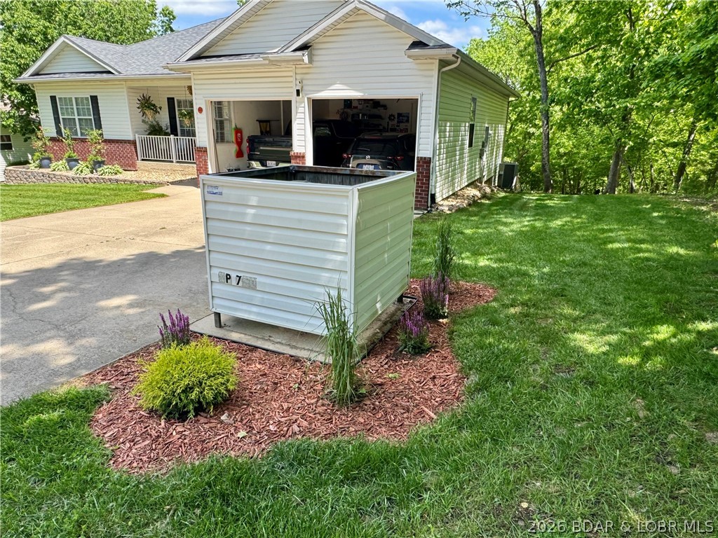 109 Reddington Road Four Seasons, MO 65049 - Photo 5 of 71 The side exterior highlights the property's proxim