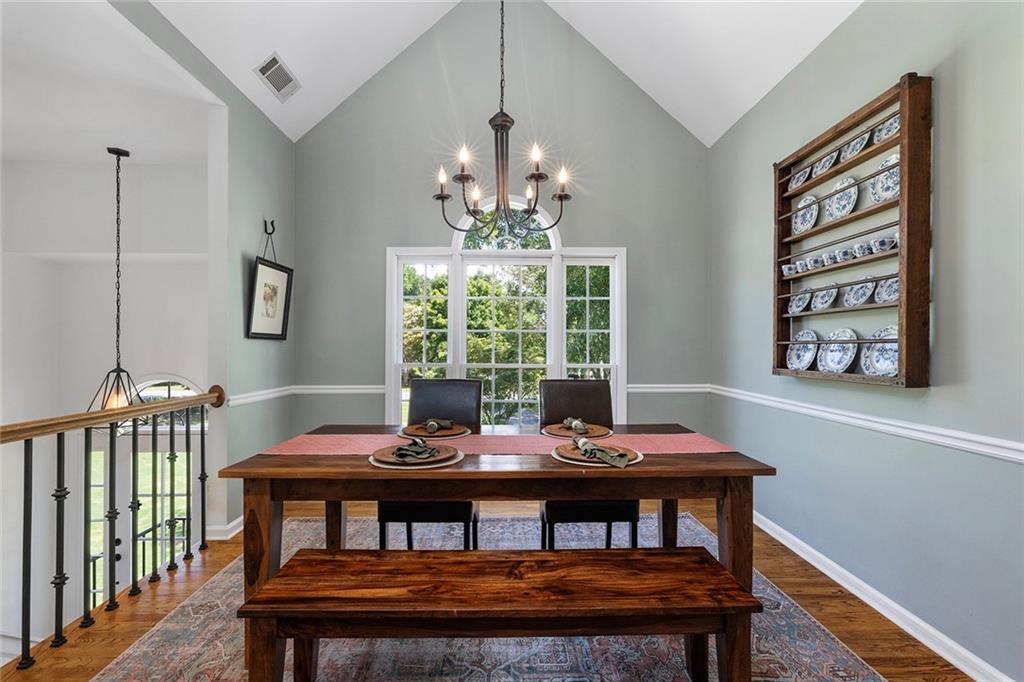 915 Taylor Parkway Suwanee, GA 30024 - Photo 13 of 61 a view of a dining room with furniture window and outside view