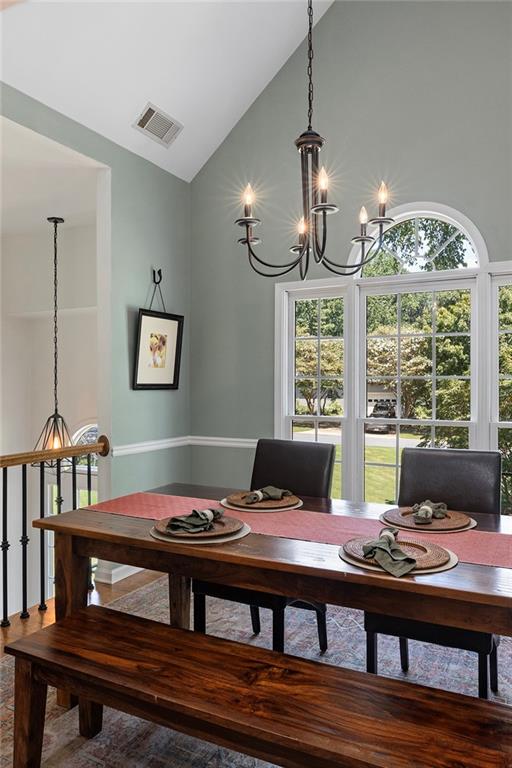 915 Taylor Parkway Suwanee, GA 30024 - Photo 14 of 61 a view of a dining room with furniture window and wooden floor