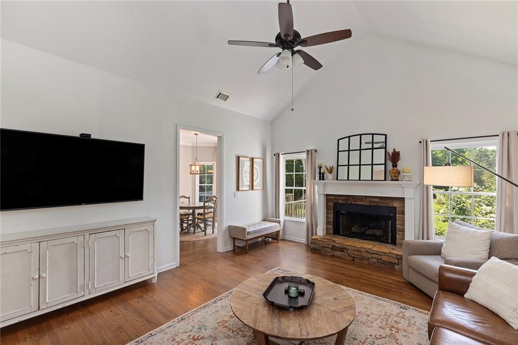 915 Taylor Parkway Suwanee, GA 30024 - Photo 27 of 61 a living room with furniture and a fireplace