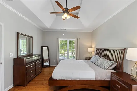 a white bath tub sitting next to a shower