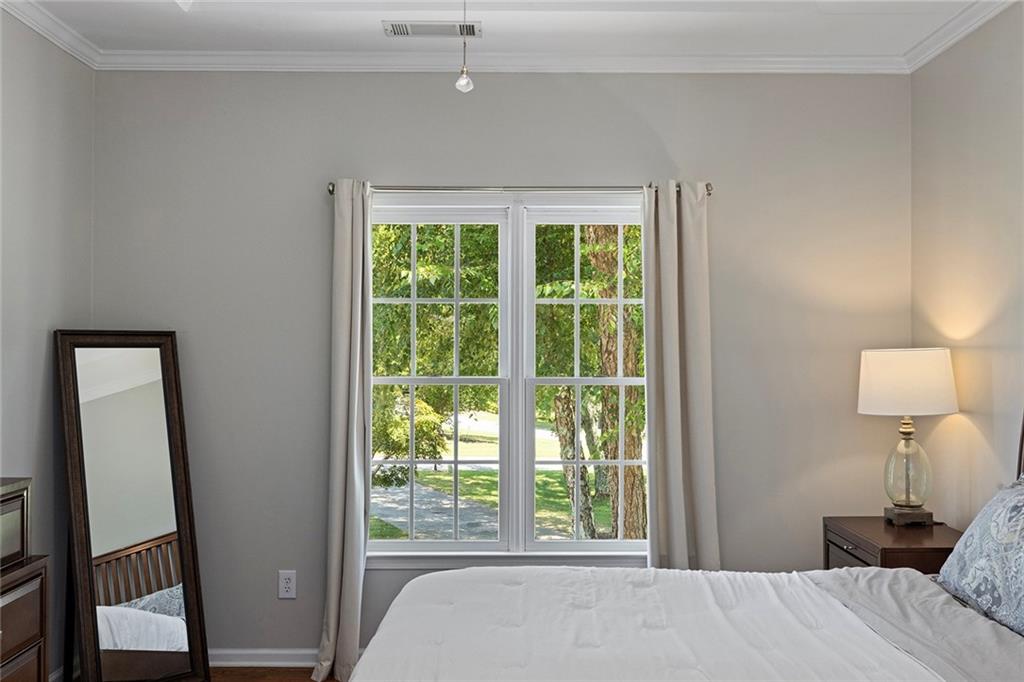 915 Taylor Parkway Suwanee, GA 30024 - Photo 30 of 61 a bedroom with a bed and a window