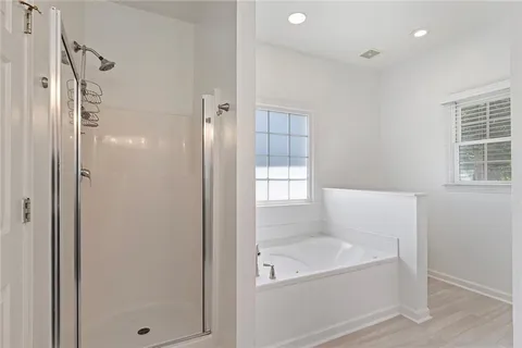 a bathroom with a toilet a sink and a mirror